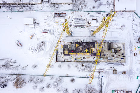 Worksite covered in snow during the winter time.