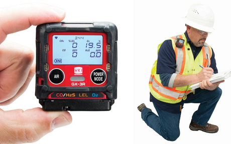 White background with closeup of hand holding RKI's GX-3R multi-gas monitor next to a worker kneeling and wearing it on his vest. 