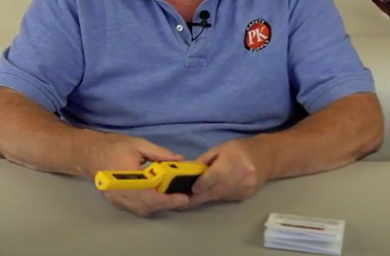 Close up of man holding BOLO Combustible Gas Sniffer.