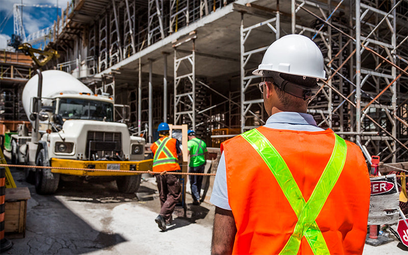 Construction worker looking towards the jobsite.