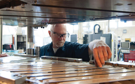 A worker wears safety glasses on the job.