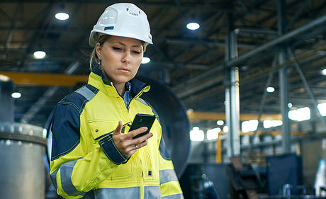 Worker using mobile app.