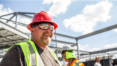 Worker wearing a wide-brimmed hard hat.