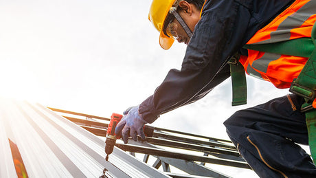 Construction worker wearing eye protection.