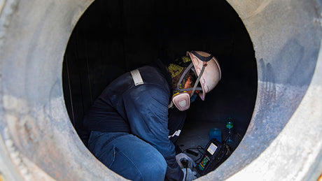 Worker in confined space.