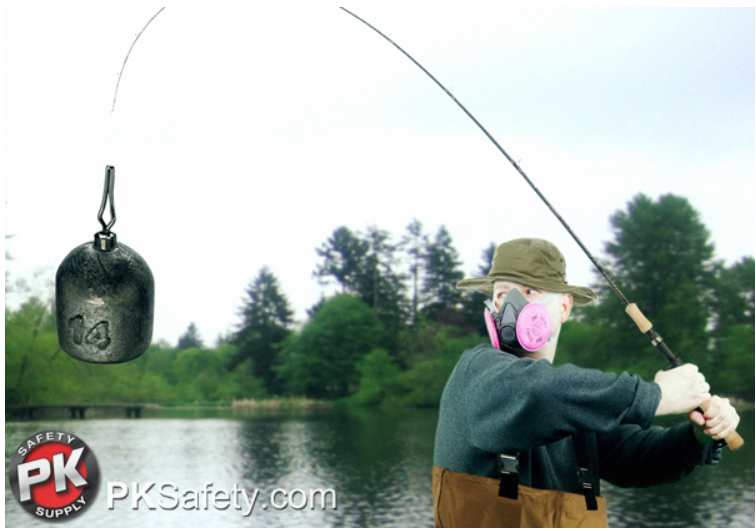 Guy wearing a respirator and holding fishing pole with led weight attached. Lake in the background.