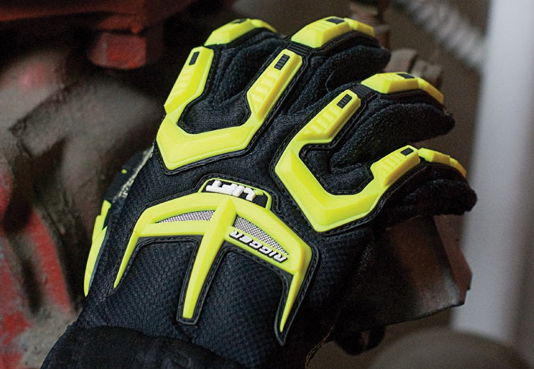 Yellow and black safety gloves holding onto something metal with blurred background.