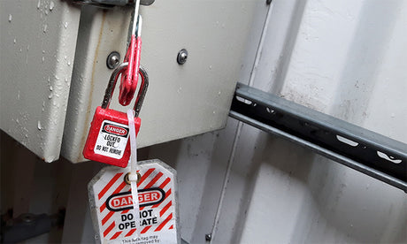 Lockout Tagout tag and padlock.