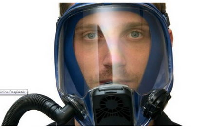 Man wears Allegro Full Face Constant-Flow Airline Respirator with white background