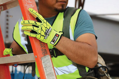 Worker climbing ladder while wearing hi-vis safety gloves.