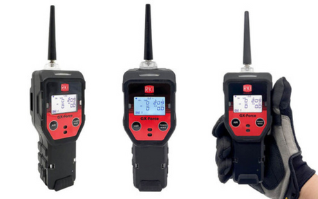 Three portable gas detection devices with antennas and red front panels, shown in black casing. One is held by a gloved hand, depicting ease of use.