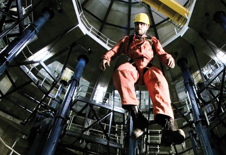 Man suspended after a fall while wearing a person demonstrating the MSA Latchways Personal Rescue Device.