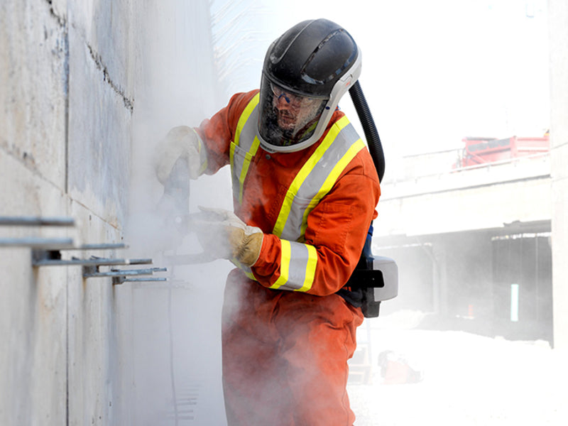 A respirator like the one this worker is wearing can offer the best protection against silica dust.