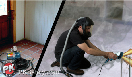 Man wearing air respirator and fumes behind him while using a power tool.