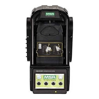 The MSA GALAXY GX2 System Test Stand for Altair 4XR, in black, features green and black labels, a display with two device icons, and front panel control buttons marked with 'The Safety Company.' This station is an integral part of the automated calibration system designed for efficient management of portable detectors.