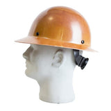 A natural tan MSA Skullgard Hard Hat with Full Brim and Fas-Trac suspension for adjustable comfort is showcased on a white mannequin head, featuring a glossy finish. Viewed from the side, it provides exceptional radiant heat protection with its sturdy design.