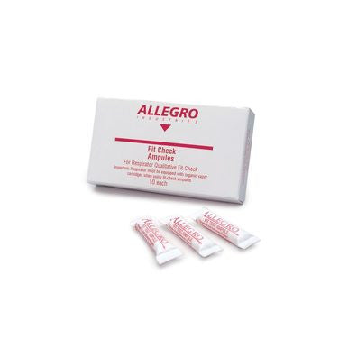 A white box labeled "Allegro Banana Oil Fit Check Testing Ampules" with three small ampoules placed next to it. The packaging includes details for fit checks and is designed for use with respirator systems or organic vapor cartridges.