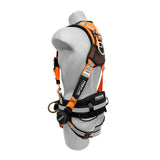 A gray mannequin wears the Frontline Combat Reflective Construction Full Body Harness 100RCTB by Frontline Fall Protection—a black and orange harness with multiple straps, metal rings, and padding for construction safety.