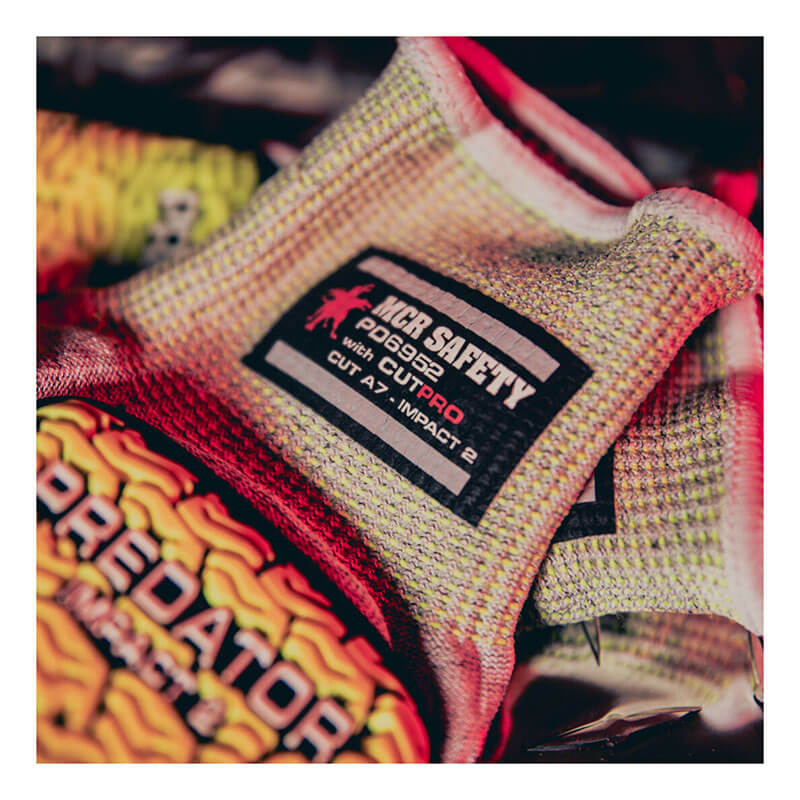 Close-up of the MCR Safety Predator Hi-Vis Mechanics Glove with HyperMax (PD6952), a yellow and red, textured, cut-resistant glove featuring the distinctive "PREDATOR" logo. Sold as 12 pairs.