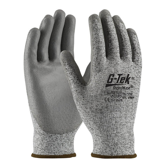 A pair of gray PIP PolyKor Blended Polyurethane Coated Gloves 16-150, featuring polyurethane-coated palms and black text on the back, designed by Protective Industrial Products for mechanical hazard protection. The seamless knit construction provides enhanced flexibility and grip. The gloves are displayed with palms facing forward and slightly angled.