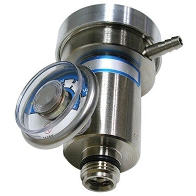 The RKI Calibration Gas Demand Flow Regulator by RKI Instruments includes a stainless steel pressure relief valve and circular gauge on top, utilizing demand flow regulator technology. This device features cylindrical components and fittings designed to regulate pressure in industrial settings, with a clear cap partially covering the gauge for precision control.