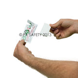 A person holds a partially opened foil packet of Coretex BugX Insect Repellent Towelettes 100/Case 12640, displaying the instructions next to the towelettes. The packet features text and symbols, while the person's hands are prominently in focus against a plain white background.