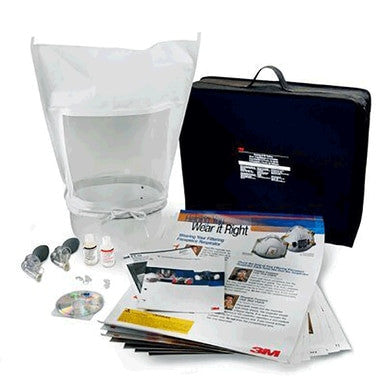 The 3M FT-20 Training and Fit Testing Kit in Carrying Case includes a clear protective hood, instructional booklets, small bottles, valves, and a black carrying case. This comprehensive set is designed to ensure safety and effective fit testing of respirators and filters.