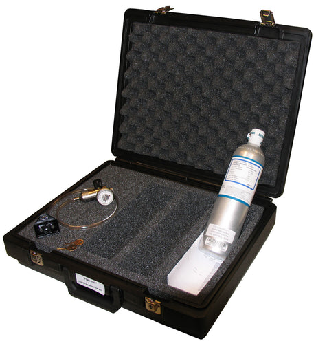 The GfG Calibration Kit With 4-Way Gas 7745-030 by GfG comes in a black case with a foam interior, which includes a metal cylindrical container, a pressure gauge, and connecting tubes. The G450 container is securely placed in a molded section, while the lid features an egg crate foam lining for added protection.