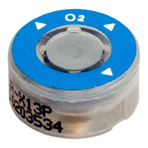 A round, blue RKI Replacement Oxygen (O2) Sensor ESR-X13P-OXY with white directional arrows pointing outward complements the GX-3R Pro gas monitors. This sensor by RKI Instruments features a transparent body that reveals some text and numbers printed on the side, ensuring efficient and accurate readings.