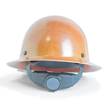 The MSA Skullgard Hard Hat with Full Brim in Natural Tan 475407, featuring a gray adjustable Fas-Trac suspension strap and the MSA logo, provides excellent head protection for construction and industrial environments, along with enhanced radiant heat protection.