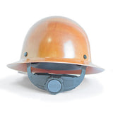 The MSA Skullgard Hard Hat with Full Brim in Natural Tan 475407, featuring a gray adjustable Fas-Trac suspension strap and the MSA logo, provides excellent head protection for construction and industrial environments, along with enhanced radiant heat protection.