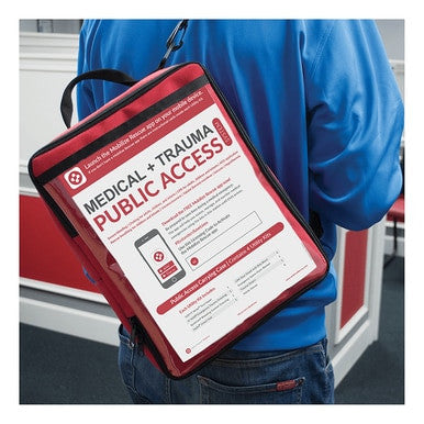 A person in a blue shirt carries a red bag labeled "ZOLL Mobilize Public Access Rescue Station 8911-005000-01," equipped with emergency instructions and a QR code for the Mobilize Rescue app. The setting, featuring red and white decor, appears to be an indoor environment designed for swift response to medical emergencies.