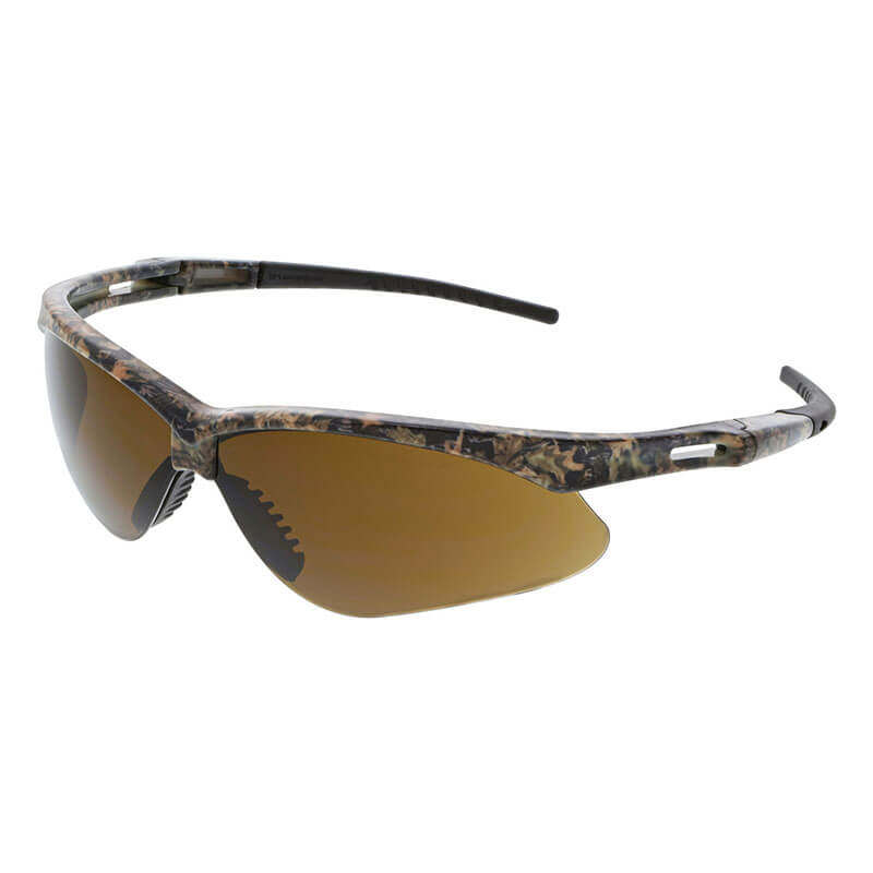 MCR Memphis MP1 Mossy Oak Safety Glasses MOMP11B by MCR Safety feature a camouflage wraparound frame, brown tinted lenses, black nose pads, UV protection, and ANSI Z87.1 compliance—ideal for outdoor or athletic use. 12/box.