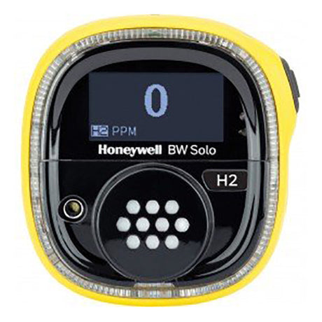 The BW Honeywell Solo Wireless Gas Detector H2 BWS1-R-Y in yellow and black shows an "0" for hydrogen concentration in PPM on its digital display. This advanced device, designed for monitoring hydrogen levels, seamlessly integrates with the IntelliDoX system for efficient data management.