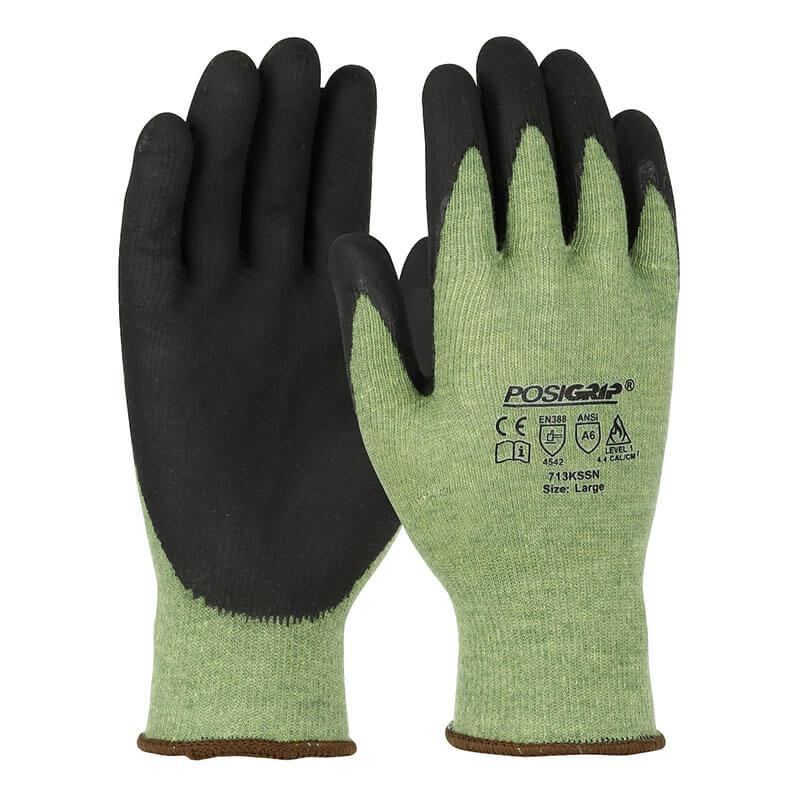 A pair of PIP PosiGrip Seamless Gloves 713KSSN featuring black nitrile foam-coated palms and fingers with light green fabric on the back. The gloves are adorned with safety symbols and are available in a size large.