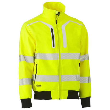 The PIP Bisley ANSI Type R Class 3 Soft Shell Jacket 333M6979T from Protective Industrial Products is a bright yellow jacket that includes reflective silver stripes across the chest, sleeves, and waist. It features a front zipper, high collar, and black cuffs and waistband for added functionality and safety.