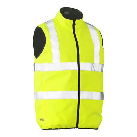 The PIP Bisley ANSI Type R Class 2 Reversible Puffer Vest 332M0330H, from Protective Industrial Products, is a bright yellow high-visibility safety vest featuring white reflective tape and a black zipper. This hi-visibility apparel includes a black inner lining, enhancing visibility and safety in low-light conditions.