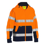 The PIP Bisley Full Zip Hooded Sweatshirt with Sherpa Lining 323M6988T by Protective Industrial Products combines high-visibility orange and navy blue with reflective stripes for safety. It features a cozy Sherpa lining, a hood, a full zipper, and pockets, meeting ANSI Type R Class 3 standards for low-light conditions.