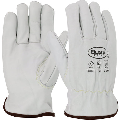 A pair of PIP Boss Xtreme Cowhide Leather Gloves KS992K, featuring white cowhide leather with brown trim, is displayed to highlight both the back and palm sides. The "PIP - Protective Industrial Products" branding is prominently featured alongside printed logos and safety ratings. These Kevlar-stitched gloves are designed for durability and abrasion resistance to provide enhanced protection.