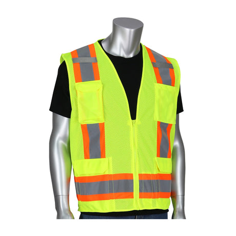 A mannequin displays the PIP ANSI Type R Class 2 Two-Tone Mesh Surveyors Vest 302-0500M, crafted with yellow mesh fabric accented by orange reflective stripes and numerous pockets. This high-visibility safety vest from PIP - Protective Industrial Products is stylishly layered over a black shirt, exemplifying hi-vis apparel.