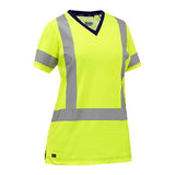 The PIP Bisley Women's Short Sleeve T-Shirt 313W1118H, from the brand PIP - Protective Industrial Products, is a high-visibility yellow safety shirt designed for women's safety apparel. It features short sleeves, reflective gray stripes on the torso and sleeves, a V-neck, and side splits at the hem. This shirt meets ANSI Class 2 standards for optimal visibility and protection.