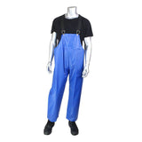 A mannequin showcases the PIP - Protective Industrial Products' TPU/Nylon Bib Overalls 201-510, offering durable protection with its TPU/Nylon construction. The blue waterproof design, complemented by black suspenders, pairs effortlessly with a black shirt and shoes, making it perfect for industrial plant maintenance.