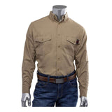 A mannequin showcases a beige PIP AR/FR Dual Certified Ripstop Long Sleeve Workshirt 385-FRRS, adorned with a small red tag on one pocket, paired with blue jeans and a brown belt. The shirt's sturdy Modacrylic/Cotton/Aramid blend from PIP - Protective Industrial Products offers both style and functionality. The background is plain white.