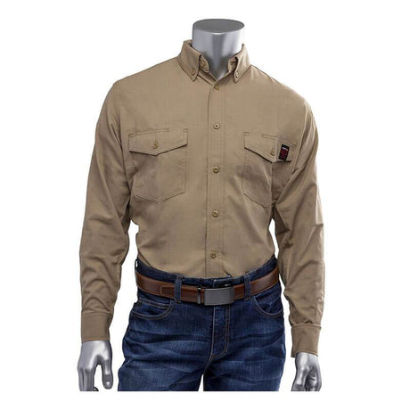 A mannequin showcases a beige PIP AR/FR Dual Certified Ripstop Long Sleeve Workshirt 385-FRRS, adorned with a small red tag on one pocket, paired with blue jeans and a brown belt. The shirt's sturdy Modacrylic/Cotton/Aramid blend from PIP - Protective Industrial Products offers both style and functionality. The background is plain white.