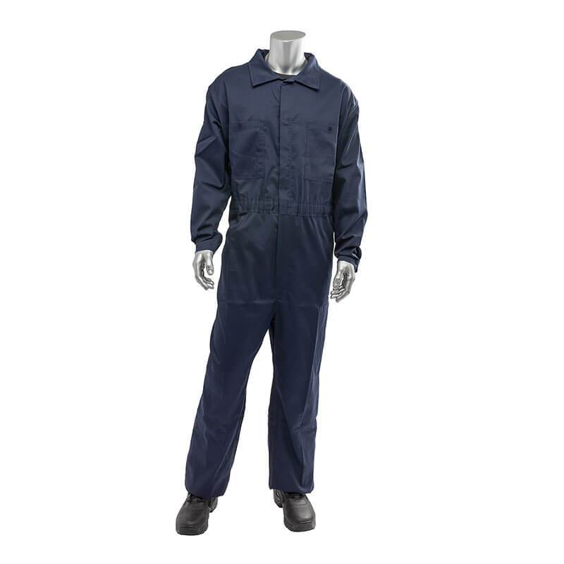 A silver mannequin modeling the PIP AR/FR Dual Certified Economy Coverall 9100-2000E in dark blue, paired with black boots, stands against a plain white background, highlighting its durability and high ARC rating.