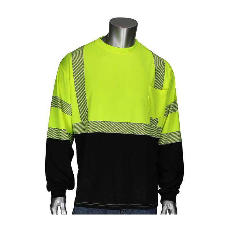 A mannequin showcases the PIP ANSI Type R Class 3 Black Bottom Long Sleeve safety shirt from Protective Industrial Products, featuring high-visibility yellow fabric, reflective stripes, a front pocket, and set against a white background.