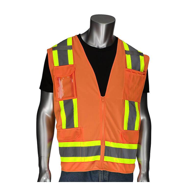 A mannequin displays the PIP Two-Tone Surveyors Vest w/D-Ring from PIP - Protective Industrial Products. This ANSI Type R Class 2 hi-visibility vest features an orange design with reflective yellow and gray stripes over a black shirt and is equipped with multiple pockets for added practicality.