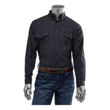 Displayed on a mannequin against a white backdrop is the PIP AR/FR Dual Certified Ripstop Long Sleeve Workshirt 385-FRRS by Protective Industrial Products. This dark shirt, featuring two chest pockets, is paired with jeans and complemented by a brown belt. Its Modacrylic/Cotton/Aramid blend ensures both durability and style.