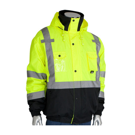 Displayed on a mannequin, the PIP Rip Stop Premium Plus Bomber Jacket (Fleece Liner, D-Ring 333-1770) by Protective Industrial Products features a durable construction and modern design. It is an ANSI Type R Class 3 safety jacket with high-visibility yellow and black color blocks, reflective silver stripes, multiple pockets, and a hood.