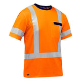 The PIP Bisley ANSI Type R Class 3 Short Sleeve T-Shirt 313M1118H, from Protective Industrial Products, comes in orange and meets ANSI Type R Class 3 standards. It is designed with reflective silver tape across the chest and shoulders and includes a dark horizontal pocket on the left side for extra functionality.